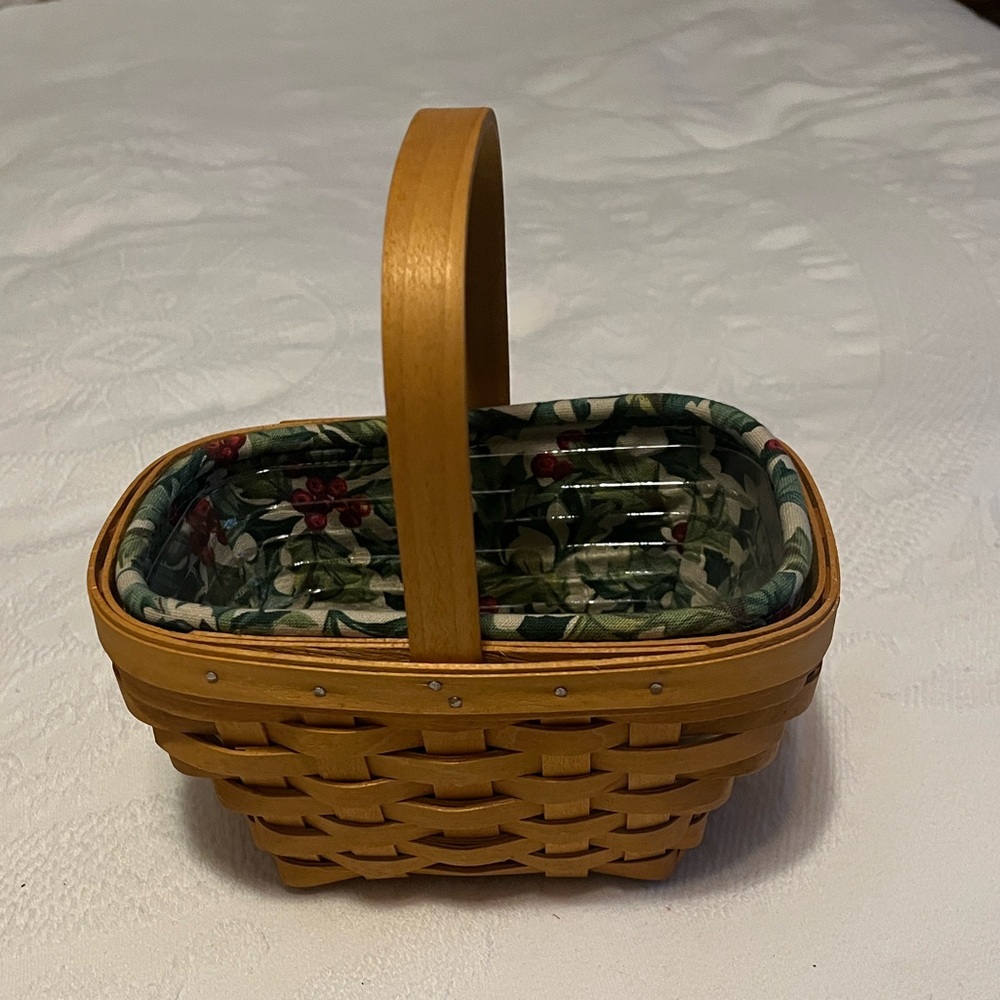 Small Longaberger basket with holiday print and plastic protector